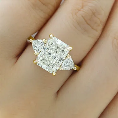 Yellow Gold Elegant Open Floating Profile Three Stone Engagement Ring jewelry store near me